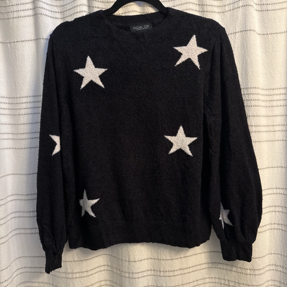 Fuzzy black sweater with white stars